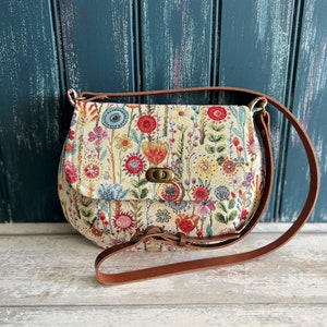The Clam Shell bag - floral tapestry messenger bag with adjustable leather strap, crossbody bag