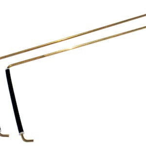 May include: Two gold-colored metal rods with black rubber handles. The rods are bent at a 90-degree angle and have a black tip on one end.