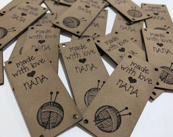 May include: A collection of brown paper gift tags with the text "made with love" and "NANA" printed on them. Each tag features a black and white illustration of a ball of yarn and knitting needles.