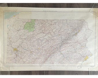 May include: A vintage map of the state of Pennsylvania, showing the state's roads, rivers, and towns. The map is printed on cream-coloured paper and has a faded, antique look.