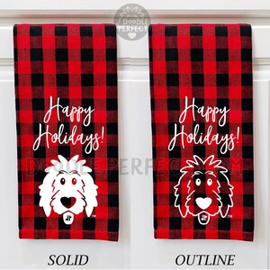 Puede incluir: Dos toallas de cocina de cuadros rojos y negros con el texto "&iexcl;Felices Fiestas!" y un garabato blanco de la cabeza de un perro. Una toalla tiene la cabeza de un perro s&oacute;lida y la otra tiene la cabeza de un perro de contorno.