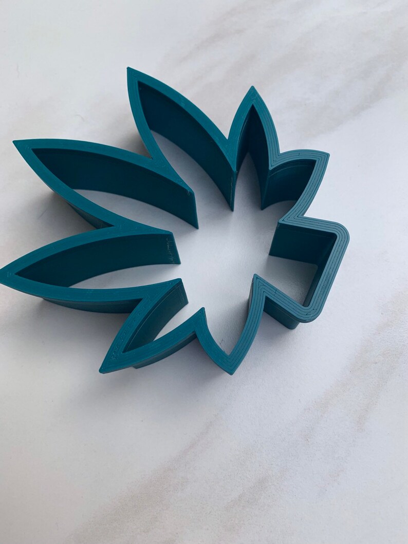 May include: A set of three ceramic nesting bowls in shades of blue, green, and white. The bowls feature a speckled glaze and a simple, modern design. The largest bowl is approximately 6 inches in diameter.