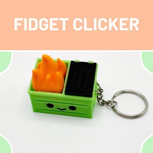 May include: A green fidget clicker shaped like a barbecue grill with orange flames and a black grill top. The keychain has a silver ring and the text "FIDGET CLICKER" is at the top.