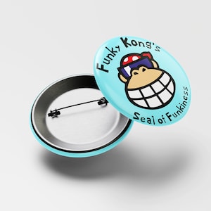 May include: A blue button with a cartoon image of Funky Kong wearing sunglasses and a red hat. The text "Funky Kong's Seal of Funkiness" is printed around the image.