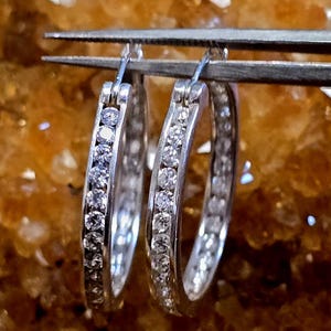 ESTATE JEWELRY, Stamped 925 DQ Cz China.  Sterling Silver Cz Inside Out Hoop Earrings. Approx. 24.7 x 24.7 x 2.7mm Approx. 5.01Grams