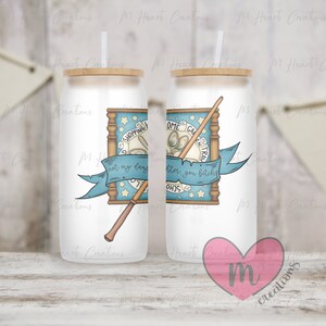 May include: White tumbler with a blue and brown illustration of a wand, a framed sign that says "Shopping Cart Not My Daughter After You Bitchy", and stars. The tumbler has a wooden lid and a straw.