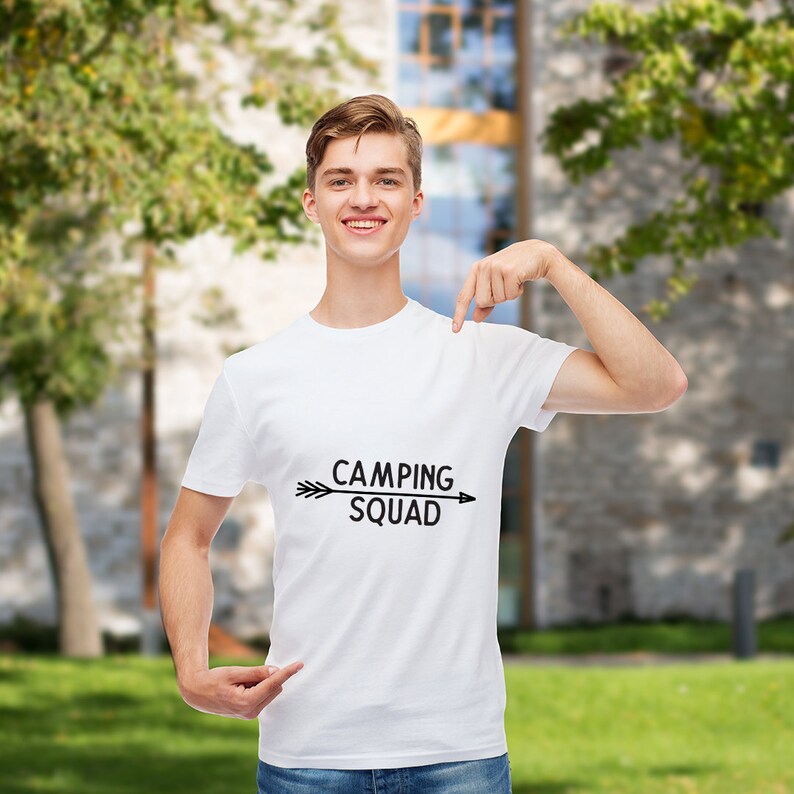 May include: A white t-shirt with a black arrow and the text "Camping Squad" printed on the front.