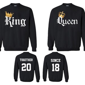 May include: Two black sweatshirts with white text and gold crown graphics. One sweatshirt says "King" and the other says "Queen". Two additional black sweatshirts with white text. One says "Together 20" and the other says "Since 18".