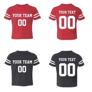 May include: Two red and two gray youth football jerseys with white stripes on the sleeves. The jerseys have a white number "00" and the text "YOUR TEAM" or "YOUR TEXT" on the front.