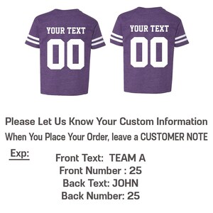 May include: Purple youth football jersey with white stripes on the sleeves and white numbers. The text "YOUR TEXT" is above the numbers on the back of the jersey. The front of the jersey has the same design.