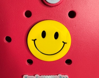 Charm de cara sonriente para bolso Bogg: un accesorio divertido para el bolso