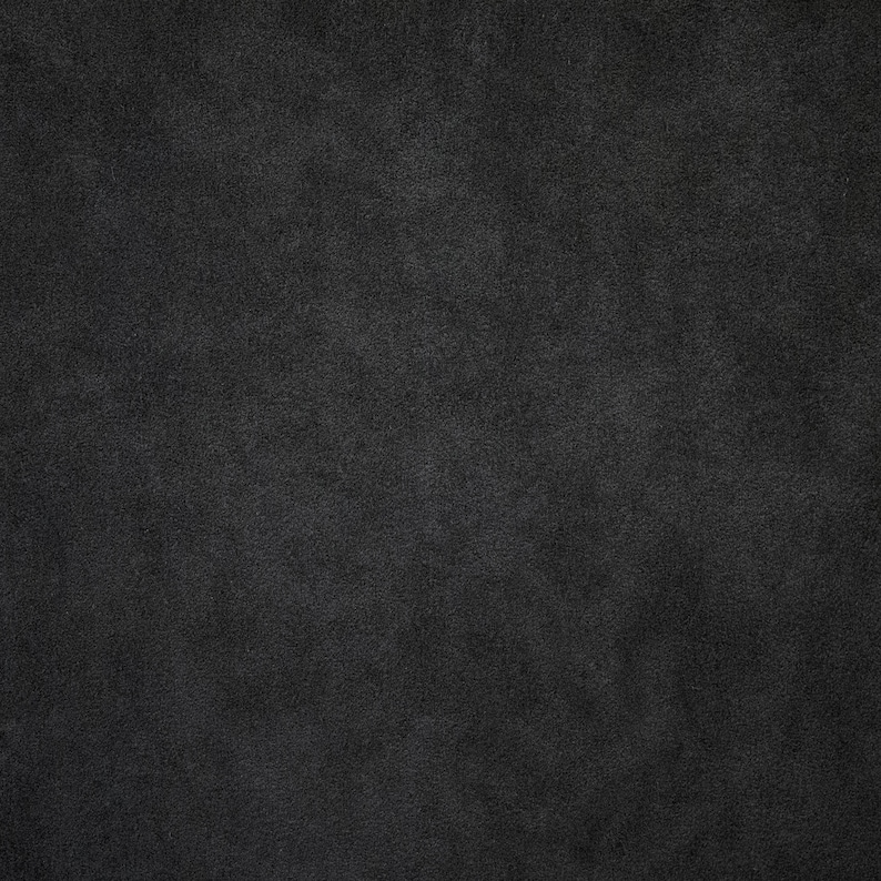 May include: A dark gray textured background.
