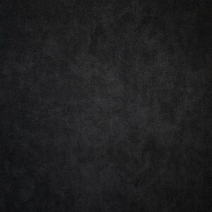 May include: A dark gray textured background.