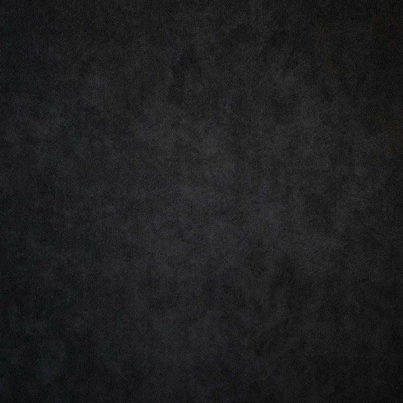 May include: A dark gray textured background.