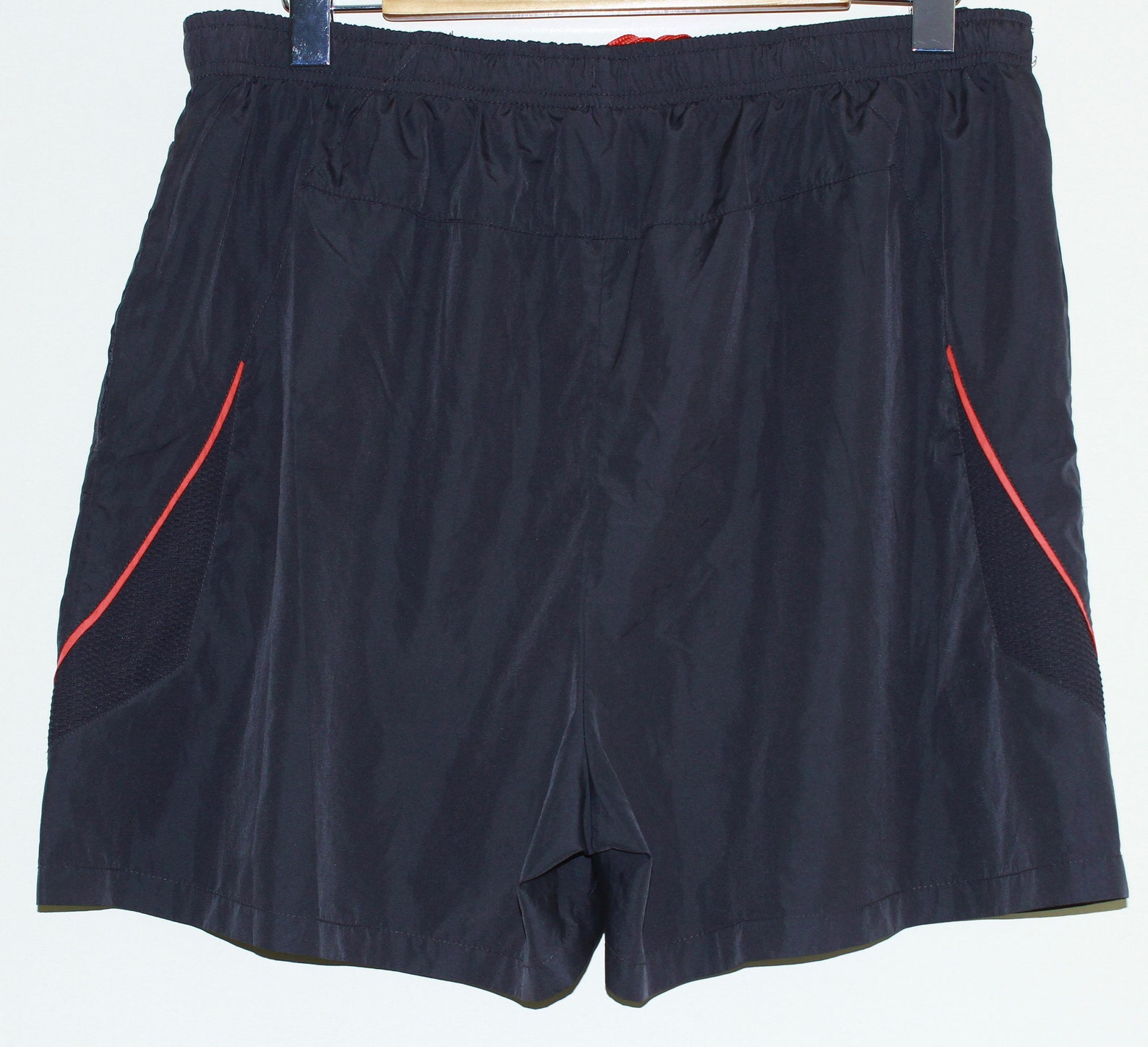 black and orange running shorts