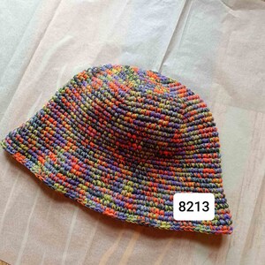 May include: A multi-colored crocheted bucket hat with a label that says "8213".