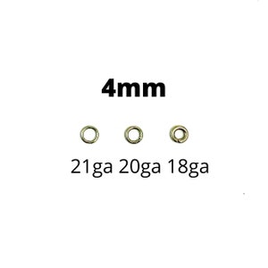 May include: Three small, silver-colored jump rings are displayed on a white background. The text "4mm" is above the rings, and below them are the text "21ga 20ga 18ga".