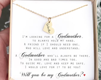 May include: A gold necklace with a heart pendant that says "Godmother" on it. The necklace is in a white box with a message that reads: "I'm looking for a Godmother, to always hold my hand. A friend if I should need one, who will love and understand. A Godmother who'll always be there, in good and bad times too. To guide me, love and keep me safe. I would love for it to be you! Will you be my Godmother?"
