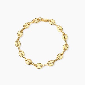 May include: A gold chain bracelet with a classic oval link design.