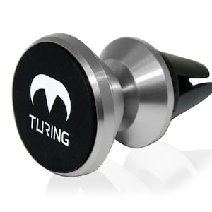 Pu&ograve; includere: Un supporto per telefono magnetico per auto in argento con una base magnetica nera. La base presenta il logo Turing e la scritta "TURING" stampata su di essa.