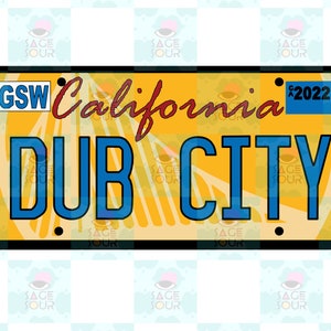 May include: A yellow license plate design with the words "California" and "DUB CITY" in blue. The plate also features the letters "GSW" and the year "2022". The background has a citrus fruit design.
