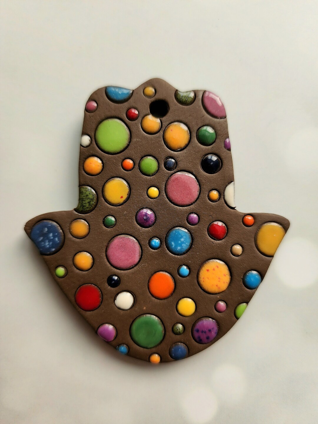 Ceramic Colorful Bright Floating Spheres on A Brown Clay Hamsa, Ceramic