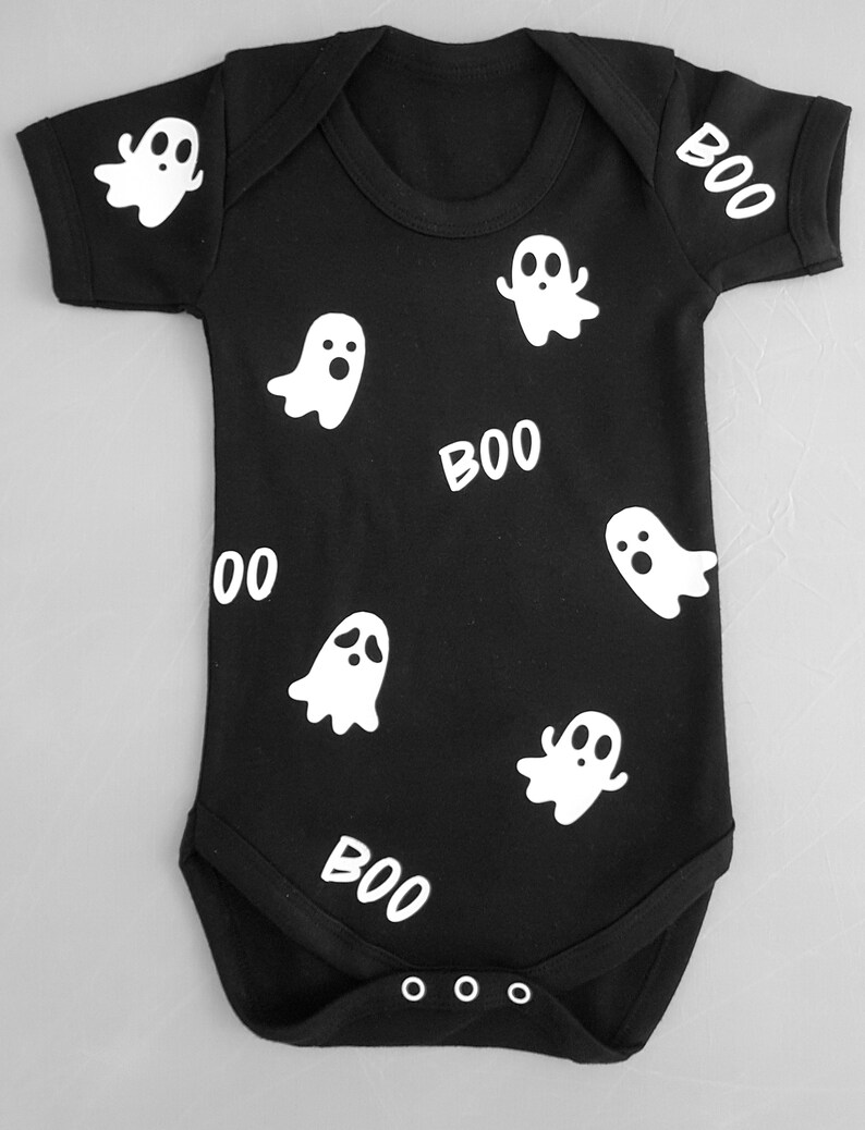 May include: Black baby onesie with white ghost and "BOO" print.