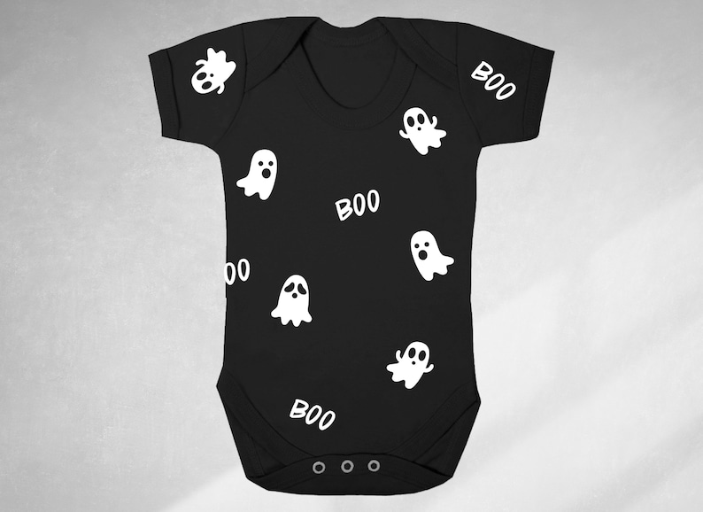 May include: Black baby onesie with white ghost and "BOO" print.