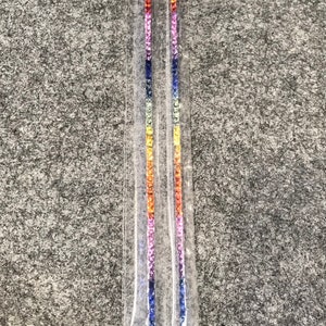 May include: Two strands of rainbow coloured gemstones, likely sapphires, are displayed on a white background. The gemstones are arranged in a graduated colour pattern, starting with blue and ending with yellow.