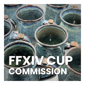 May include: A collection of blue and brown ceramic mugs with a speckled glaze. The mugs have a rounded shape and a handle on one side. The text "FFXIV CUP COMMISSION" is printed on the front of the mugs.