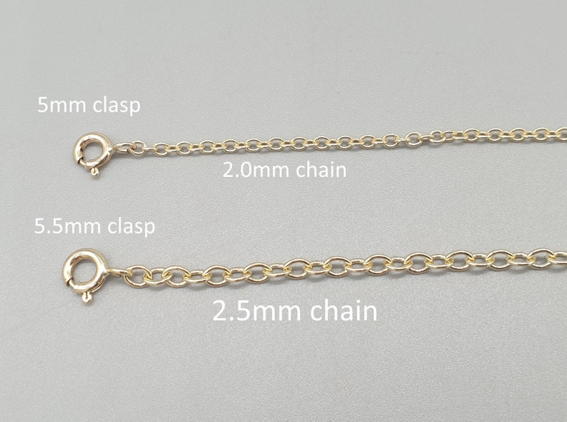 May include: Two gold-colored chain necklaces with clasps are displayed against a gray background. The top chain has a 5mm clasp and a 2.0mm chain. The bottom chain has a 5.5mm clasp and a 2.5mm chain.