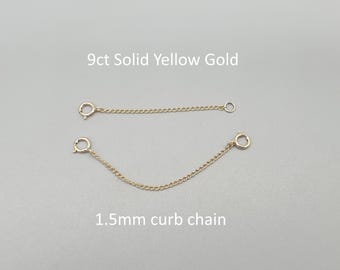 May include: Two 9ct solid yellow gold chain extenders. The top chain is straight, and the bottom chain is curved. Both chains have a 1.5mm curb chain design. Each chain has a clasp on one end and a ring on the other.