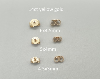 May include: A selection of 14ct yellow gold earring backs, including sizes 6x4.5mm, 5x4mm, and 4.5x3mm. The earring findings are shown on a light grey background.