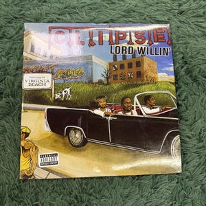 May include: A square music album cover titled Clipse Lord Willin' featuring an illustration of three people in a black convertible car. The background shows a brick building, a sign reading Welcome to Virginia Beach, and a Parental Advisory label.