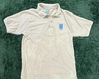 Polo vintage de los Juegos Olímpicos de Atenas 2004, de alta calidad, color beige, talla XL, con logo bordado.