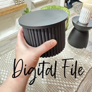 May include: A miniature black side table with a ribbed cylindrical base and a flat top. The table is held in a hand. The text "Digital File" is written in cursive across the bottom of the image. The table is part of a miniature furniture set.