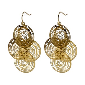 May include: A pair of gold-colored dangle earrings. Each earring features three connected, circular, openwork designs. The openwork circles have a spiral pattern. The earrings have a hook closure.