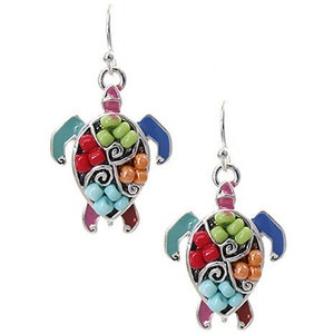 May include: A pair of silver dangle earrings featuring a colorful turtle design. The turtle is made of metal and has a multi-colored enamel finish. The turtle's shell is decorated with small beads in shades of red, orange, yellow, green, blue, and turquoise.