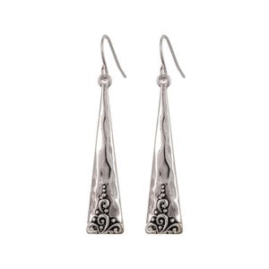 May include: Silver dangle earrings with a textured, triangular shape and a floral design at the bottom.