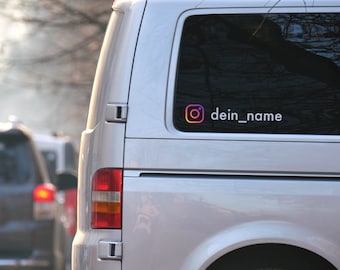 May include: A silver van with a rear window sticker featuring the Instagram logo and the text "dein_name".