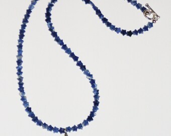 Rocket to the Stars: necklace of tiny blue sodalite stars with a silvery rocket pendant