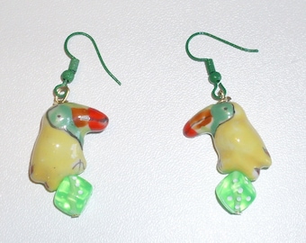 Toucan Play That Game: earrings featuring yellow ceramic toucans perched on green dice