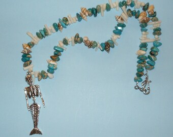 Bones of the Sea necklace: mermaid skeleton pendant with coral, sea-sediment jasper, and shell beads