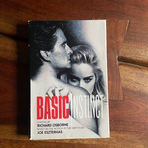 May include: A paperback novel titled "Basic Instinct" by Richard Osborne, based on the motion picture written by Joe Eszterhas. The cover features a black and white photo of a man and woman.
