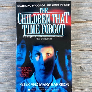 May include: A book cover with a blue, red, and white color scheme. The title is "The Children That Time Forgot" and the subtitle is "Shocking true accounts of children who remember their previous lives". The author is Peter and Mary Harrison. The book cover features a close-up of a young boy's face.