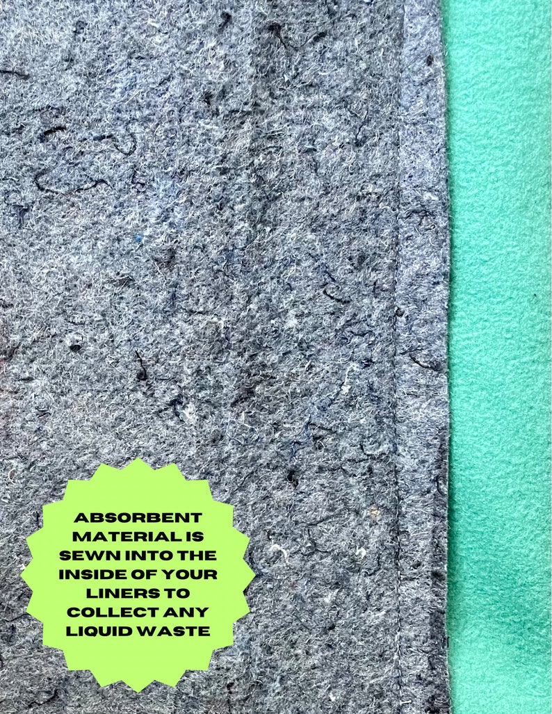 May include: Close-up of a gray fabric liner with a green fabric border. A green starburst sticker with the text "Absorbent Material is sewn into the inside of your liners to collect any liquid waste" is attached to the fabric.