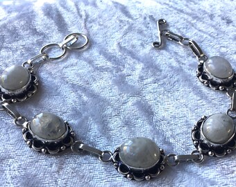 Aqua onyx bracelet with five oval horizontal stones.
