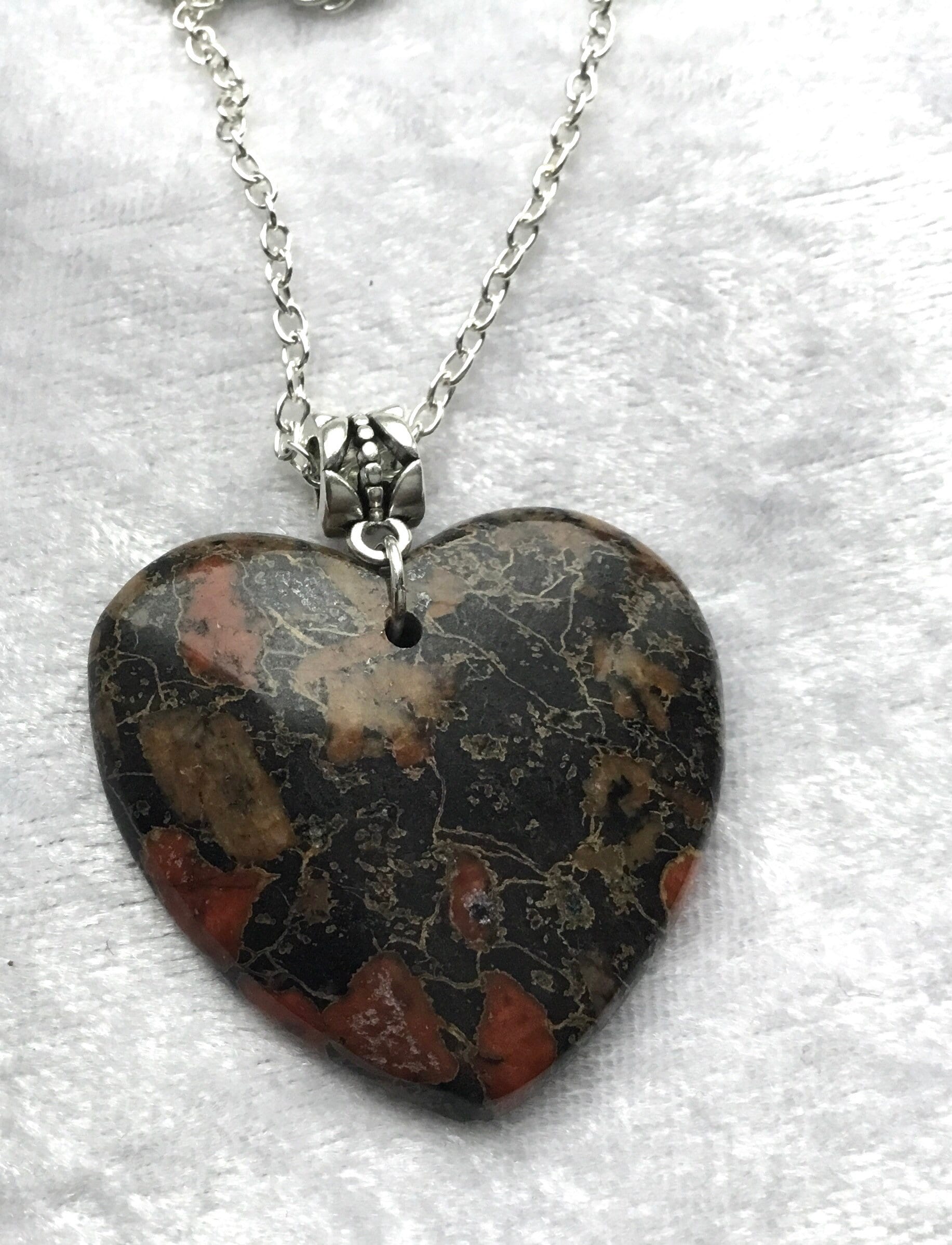 Plum blossom jade heart pendant with a silver chain. Etsy