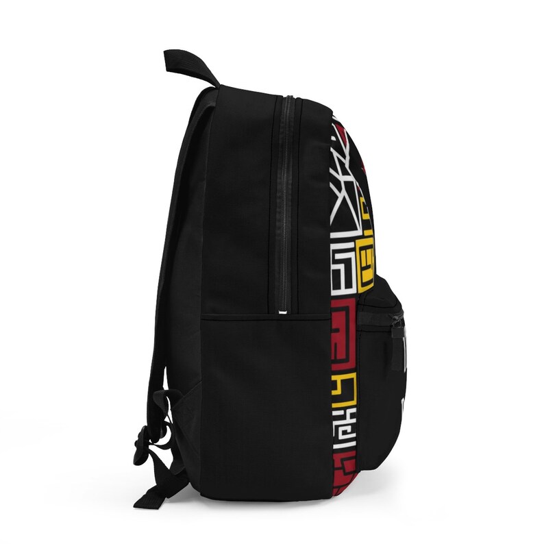 May include: Black backpack with a red, yellow, and white geometric pattern on the side. The backpack has a zippered pocket on the front.