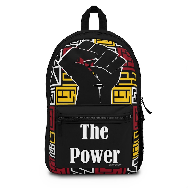 May include: Black backpack with a raised fist graphic and the words "The Power" in white. The background features a red, yellow, and black geometric pattern.